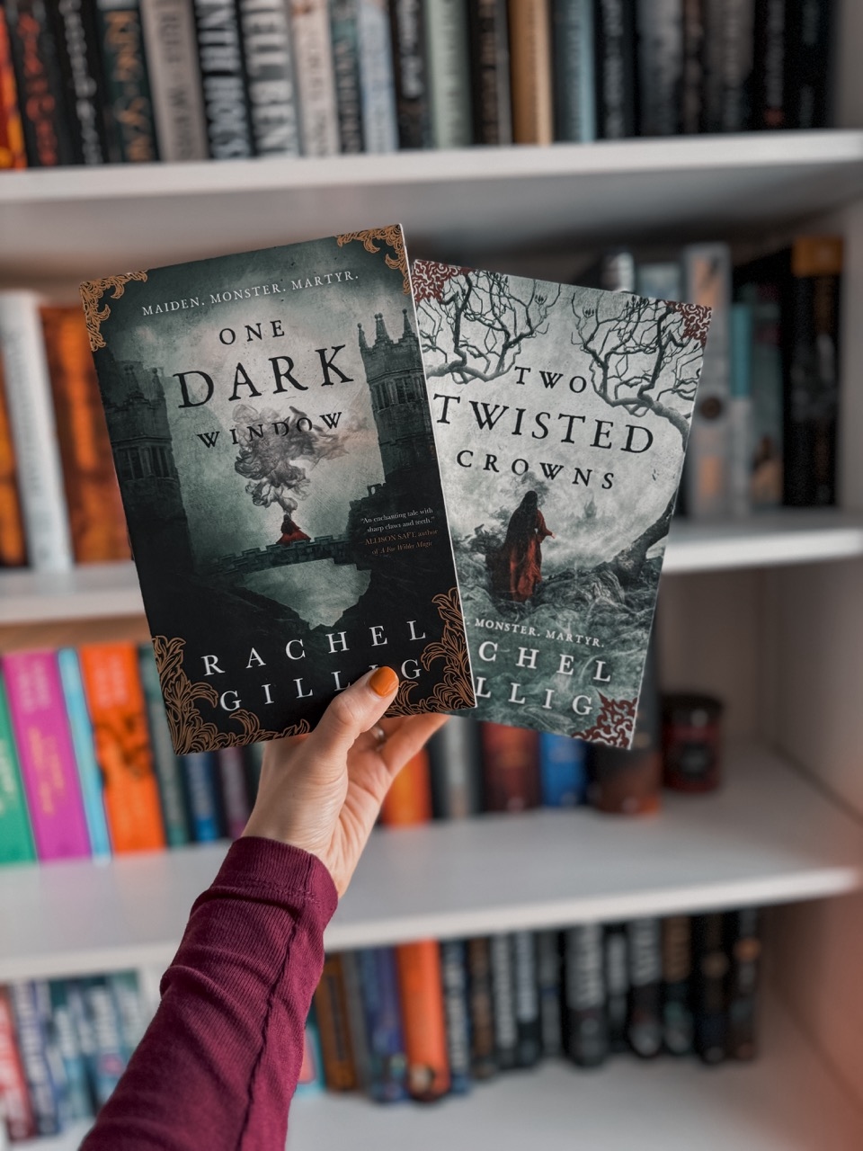 front covers of one dark window and two twisted crowns by rachel gillig